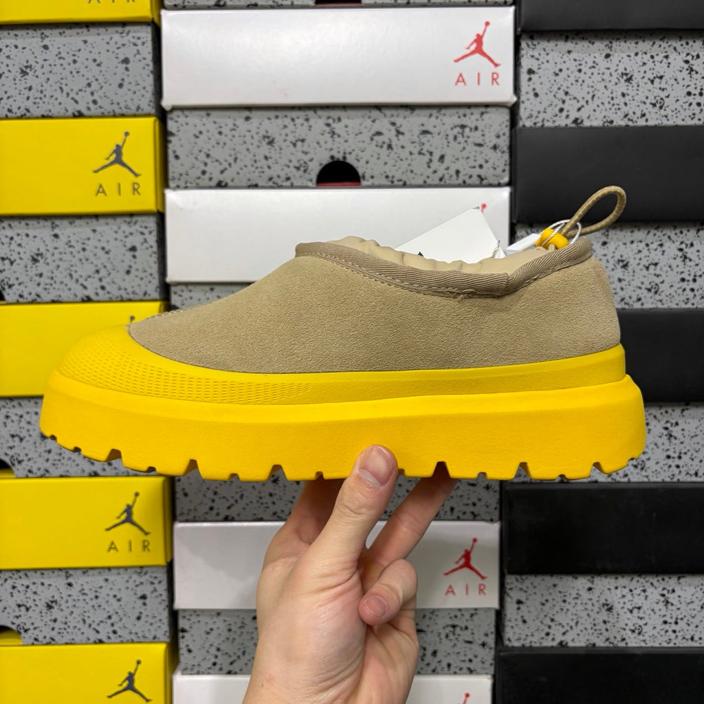 UGG Neumeel Deco Slip-On – Suede Moccasin Sneaker with Yellow Lug Sole & Carabiner Collar in Sand