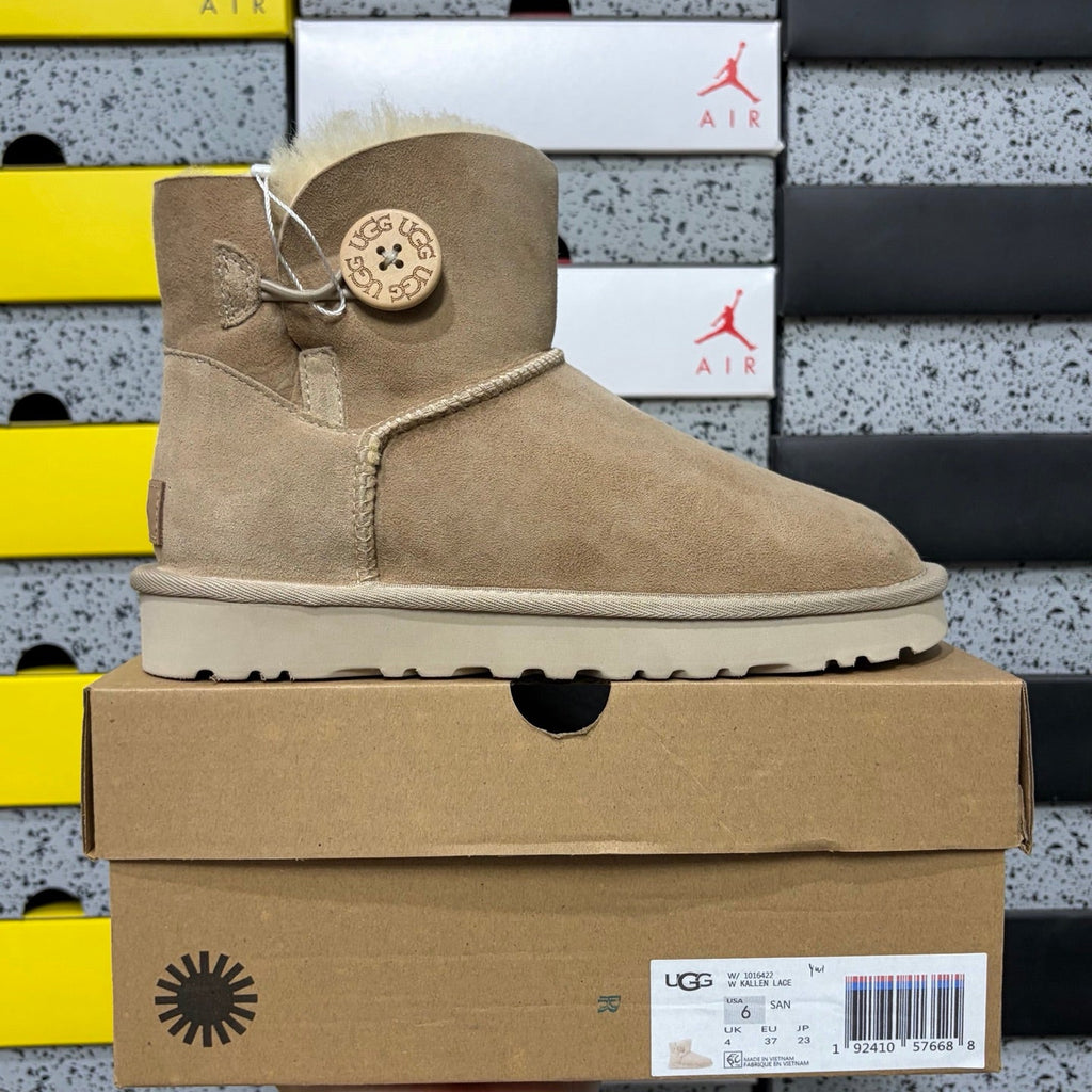 UGG Kallen Lace Mini Boot – Suede Ankle Boot with Shearling Cuff & Signature Button Closure in Sand