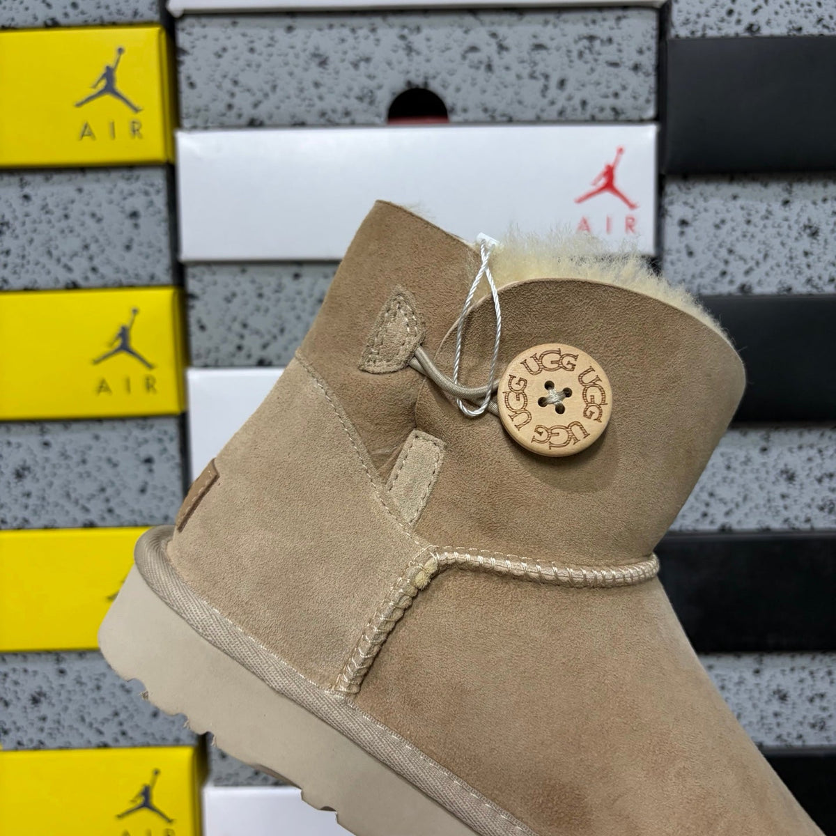 UGG Kallen Lace Mini Boot – Suede Ankle Boot with Shearling Cuff & Signature Button Closure in Sand
